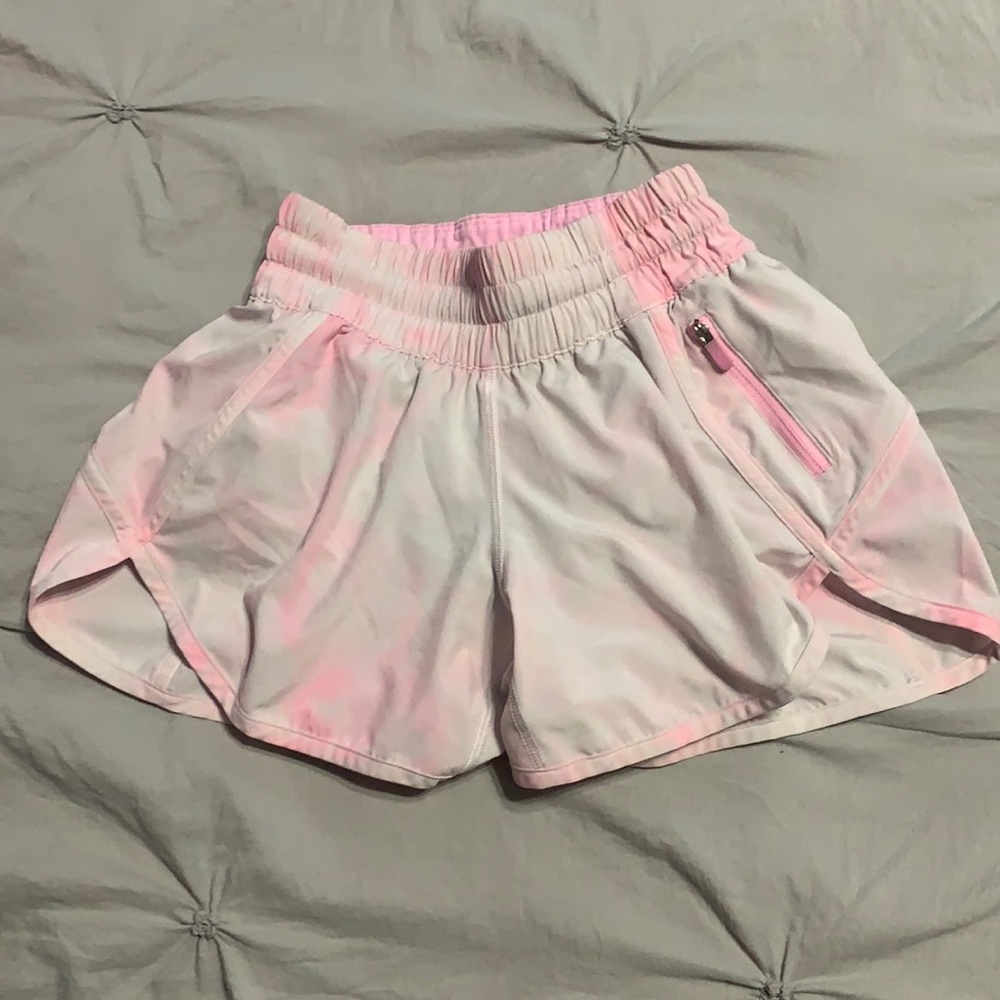 Size 2, pink and white, lululemon shorts with a zipper and an adjustable strap.